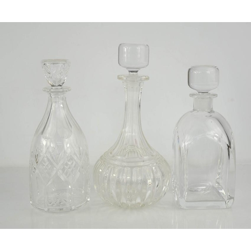 138 - Three cut glass decanters.