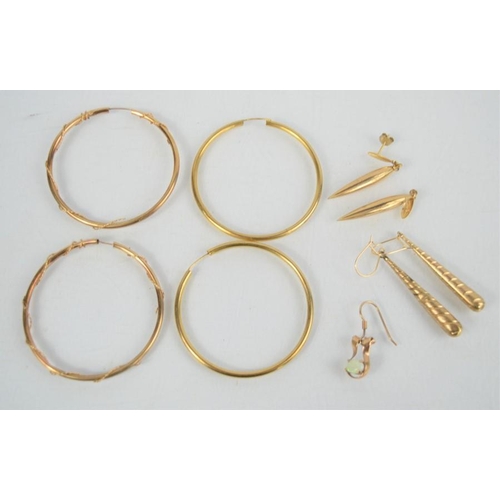 151 - Two pairs of 9ct gold hoop earrings together with a pair of 9ct gold pointed pendant drop earrings a... 