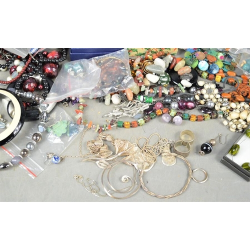 154 - A large quantity of jewellery to include brooches, earrings, pocket watch, necklaces, some silver ex... 