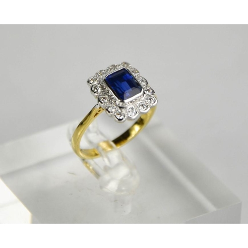 157 - An 18ct yellow and white gold, sapphire (1.10ct) and diamond (0.48ct)  ring, size O, 4.1g.