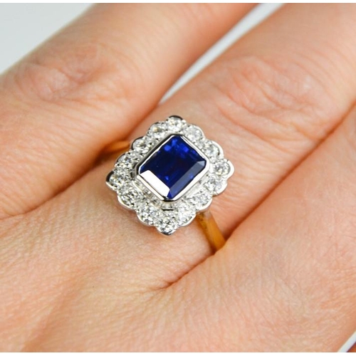 157 - An 18ct yellow and white gold, sapphire (1.10ct) and diamond (0.48ct)  ring, size O, 4.1g.