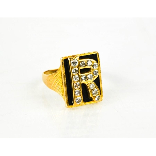 165 - A gold (unmarked) signet ring, bearing the initial R, set with diamonds, size R/S. 7.8g.