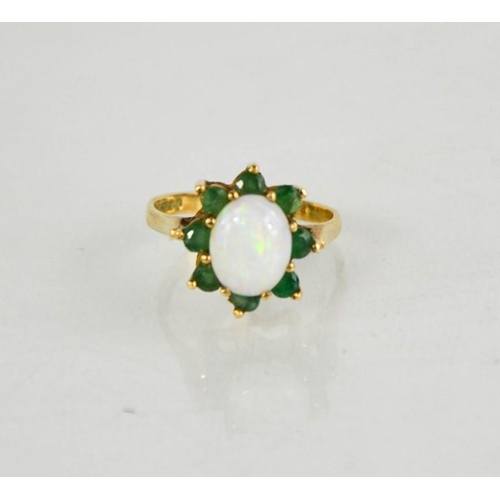 174 - A 9ct gold, opal and emerald flowerhead ring, 3.36g.