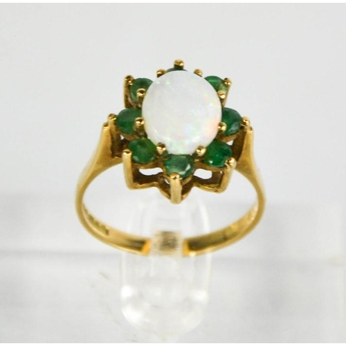 174 - A 9ct gold, opal and emerald flowerhead ring, 3.36g.