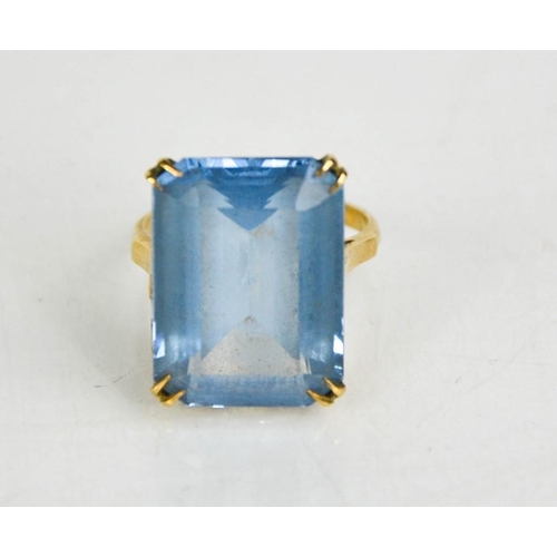 183 - A 9ct gold and blue topaz ring, size P, 7.84g.