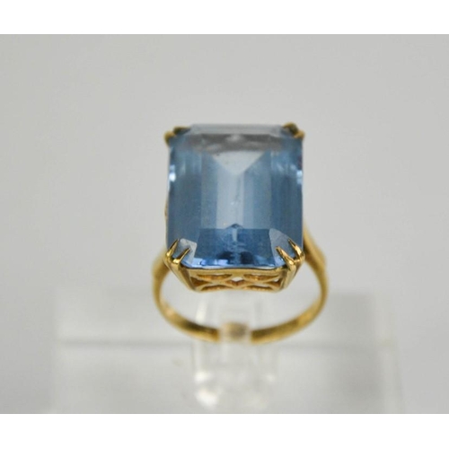 183 - A 9ct gold and blue topaz ring, size P, 7.84g.