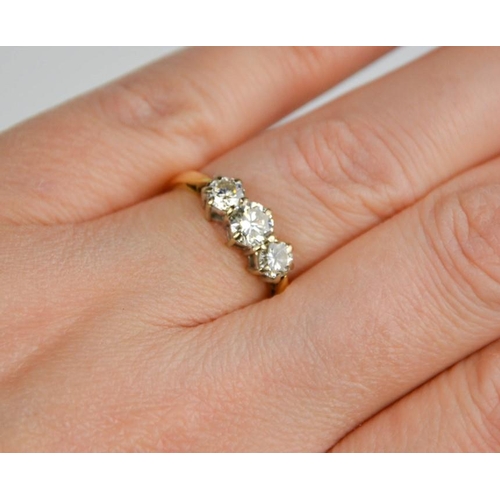 194 - An 18ct gold three stone diamond trilogy ring, 1ct total diamond weight, size L½, 3g.