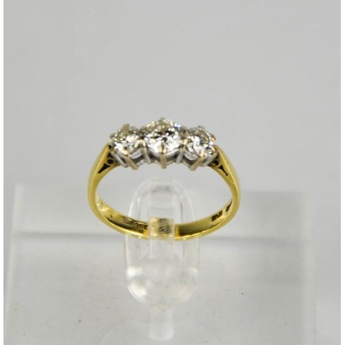 194 - An 18ct gold three stone diamond trilogy ring, 1ct total diamond weight, size L½, 3g.