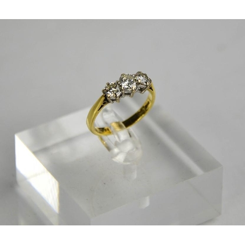 194 - An 18ct gold three stone diamond trilogy ring, 1ct total diamond weight, size L½, 3g.