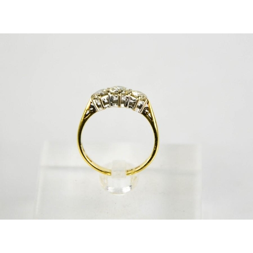 194 - An 18ct gold three stone diamond trilogy ring, 1ct total diamond weight, size L½, 3g.