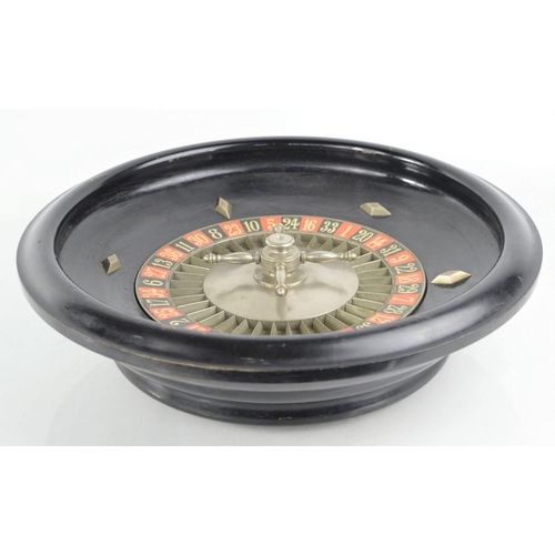 487 - A late 19th century French roulette wheel stamped Roulette Francaise, Marque Deposee