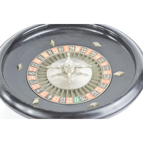 487 - A late 19th century French roulette wheel stamped Roulette Francaise, Marque Deposee