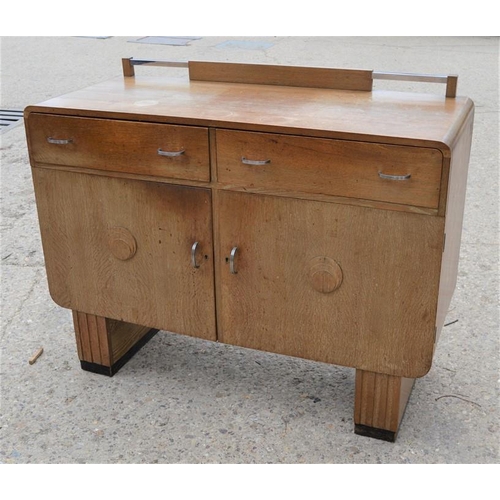 551 - A Mid-century sideboard with two drawers above two cupboard doors, 121cms long x 51cms deep x 96cms ... 