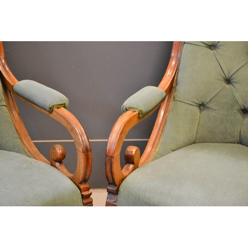 556 - A pair of 19th century William IV mahogany chairs, with scroll arms, serpentine seat fronts, turned ... 