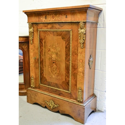 563 - A fine 19th century figured walnut pier cabinet, inlaid with a vase of flowers to the single door, g... 