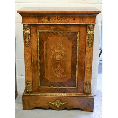 563 - A fine 19th century figured walnut pier cabinet, inlaid with a vase of flowers to the single door, g... 