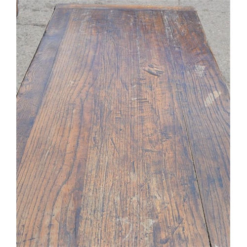 566 - An oak refrectory table, the planked top with cleated ends, raised on lyre form legs and central str... 