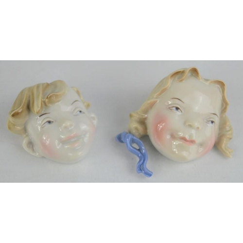 90 - Two Metzler and Ortloff porcelain wall hanging face masks of boy and girl