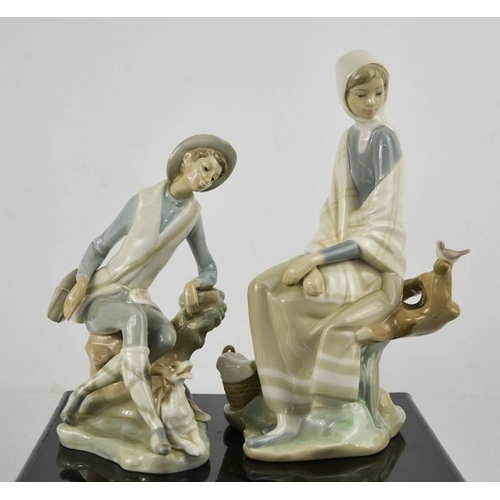 92 - Two Lladro figurines: Shepherd with Dog and Girl Sitting Watching Bird on a Branch, number 4576, 24c... 