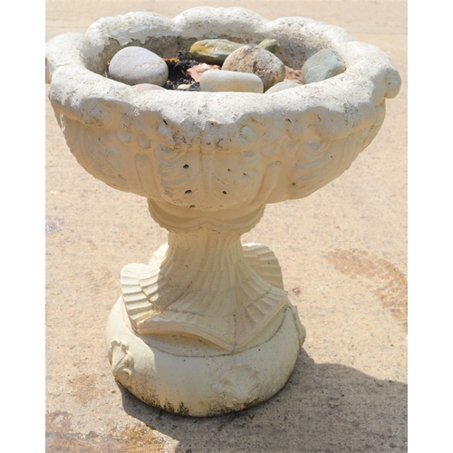 567 - A reconstituted stone garden planter on stand.