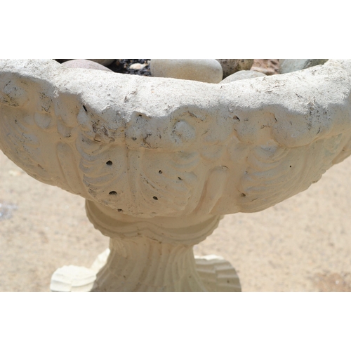 567 - A reconstituted stone garden planter on stand.