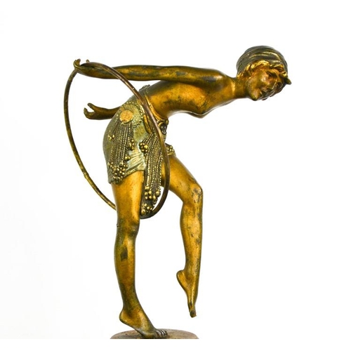 10 - Dimitri Chiparus (1886-1947): a bronze Art Deco dancer with hoop, raised above a marble potpourri di... 