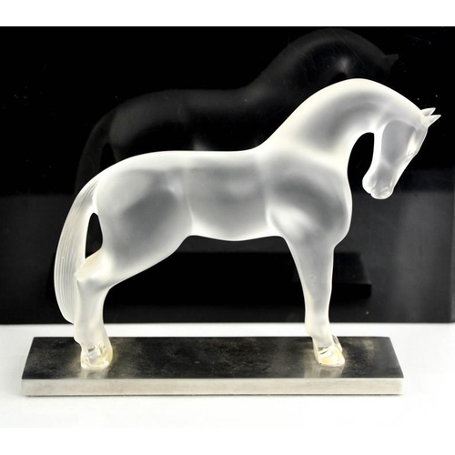 33 - A Lalique opaque glass horse on metal base, signed to the back feet Lalique, France, bearing label t... 