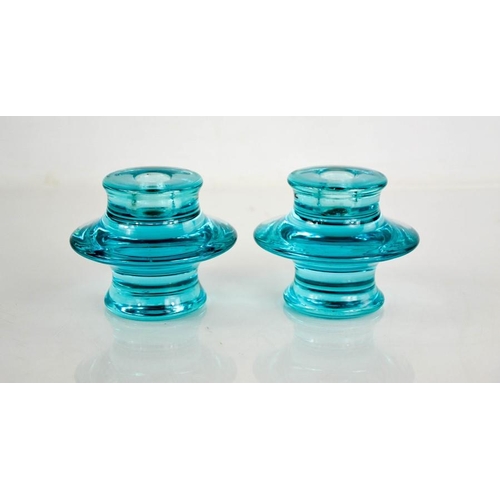 37 - A pair of blue glass candlesticks. 9.5cms tall