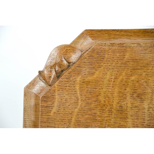 110 - An early Robert Thompson 'Mouseman' bread board, with carved mouse signature, 30cm wide.