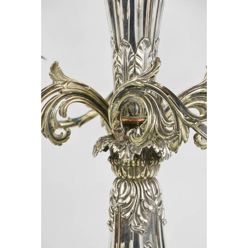 116 - An impressive 19th century silver plated centrepiece with four scrollwork removable branches raising... 