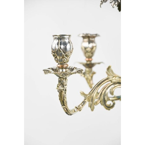 116 - An impressive 19th century silver plated centrepiece with four scrollwork removable branches raising... 