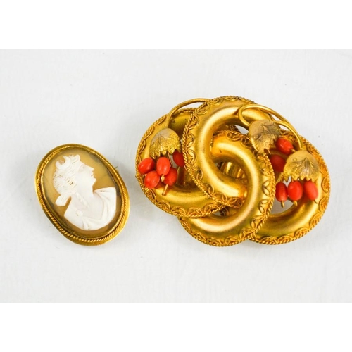 175 - A Victorian pinchbeck and coral brooch, together with a gilt metal cameo brooch depicting classical ... 