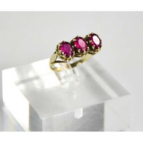 185 - A 9ct white gold and pink tourmaline three stone ring, size O, 3.65g.