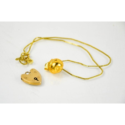 209 - A 9ct gold heart form lock, 2.2g, and a silver gilt Flora Danica of Denmark nut pendant.