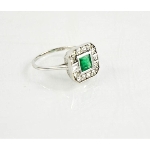 220 - An 18ct white gold Art Deco style emerald and diamond ring, J½, 2.7g.