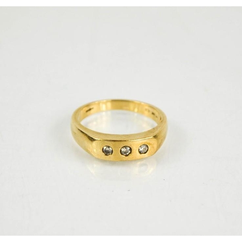 226 - A 9ct gold and diamond three stone ring, size U/V, 5.1g.