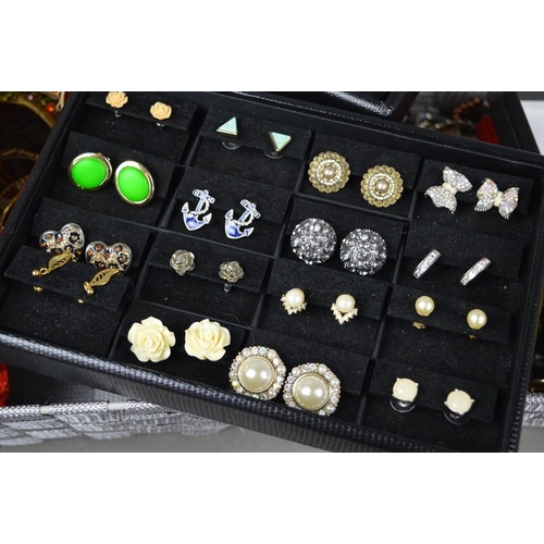 236 - A large quantity of costume jewellery include earrings, bangles, necklaces some silver examples