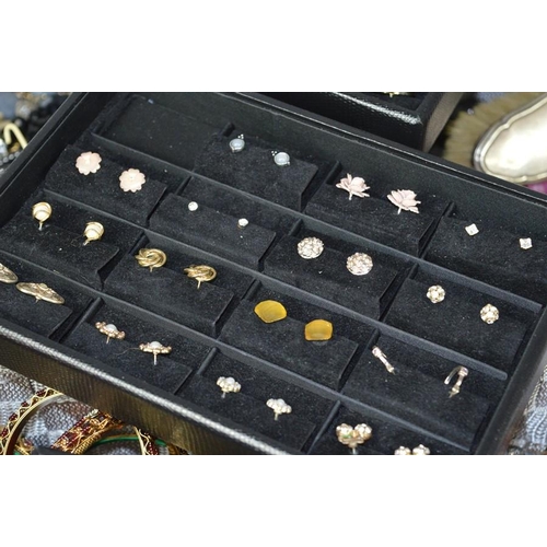 236 - A large quantity of costume jewellery include earrings, bangles, necklaces some silver examples