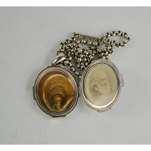 237 - A Victorian silver locket, containing locket of hair, and photograph on chain.