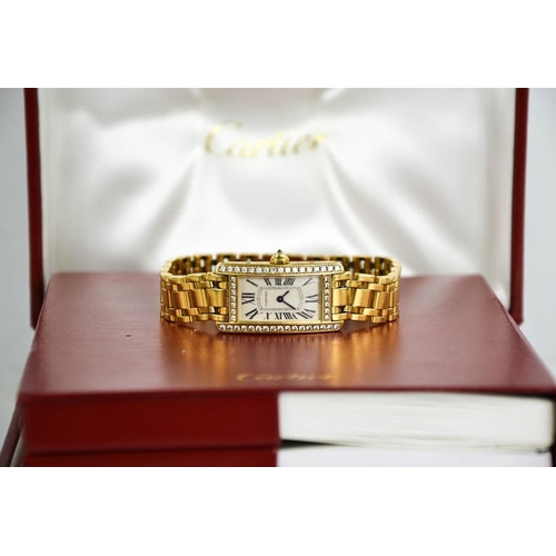 253 - An 18ct gold and diamond Cartier wristwatch, in the Tank Americaine design, silver grained dial read... 