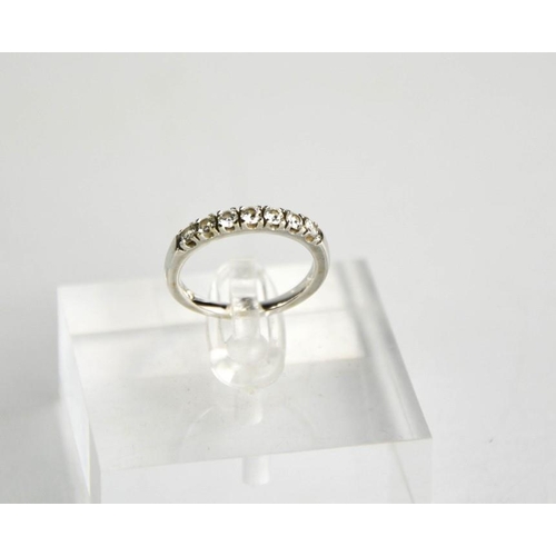 264 - An 18ct white gold and diamond ring, the seven diamonds totalling 0.4ct, size K½.