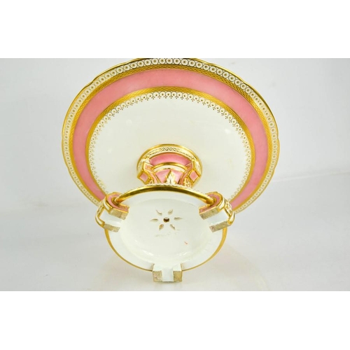 282 - A 19th century Minton porcelain comport, with a pink ground, enhanced with gilded decoration, raised... 