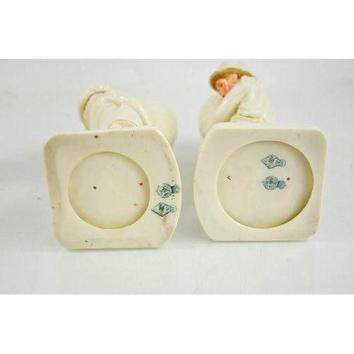 312 - A Royal Worcester porcelain salt and pepper, modelled as a boy and girl, circa 1880, 7 ins high.