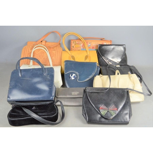 477 - A group of vintage handbags to include Studio Harmonique, Jane Shilton examples, together with a lar... 