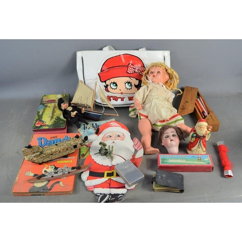 482 - A group of vintage toys and dolls to include a Betty Boop bag, German bisque dolls head etc