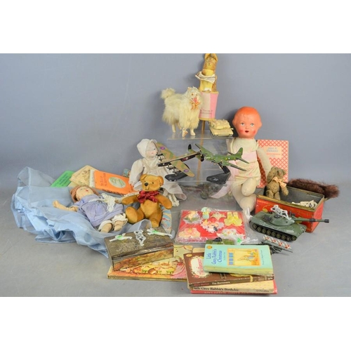 483 - A group of vintage toys and books to include Dinky, Beatrix Potter stick puppet, dolls etc