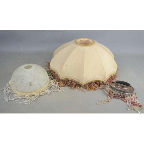 487 - Three vintage lightshades one opaque glass example, adorned with white and clear glass beads, a silk... 