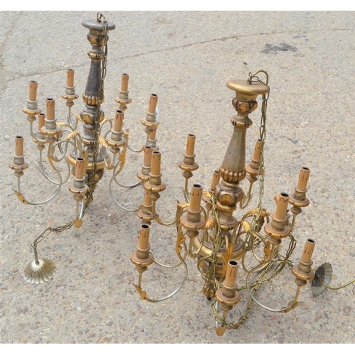 488 - A pair of 20th century wood and metal twelve branch chandeliers with gold decoration