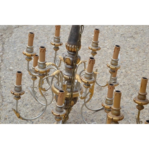 488 - A pair of 20th century wood and metal twelve branch chandeliers with gold decoration