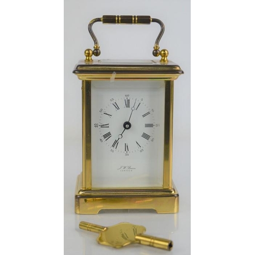 491 - A J.W Benson of London brass cased carriage clock with roman numeral dial, with key